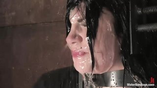 Amazingly sexy busty brunette enjoys hardcore water bondage