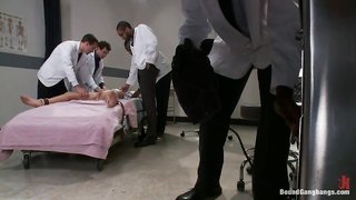 Cuffed big-boobed brunette and crazy doctors