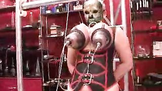 Awesome lady in black mask is getting two vacuum toys on her boobs
