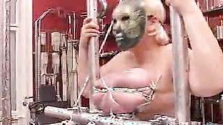 Big-boobed lady in dark mask is enjoying tight boob bondage
