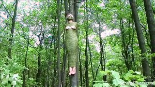 Extremely brutal and tight bondage for a big-tit doll in forest