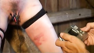 High-heeled chick on black high heels gets chained in the barn