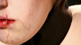 Crazy master is stitching her mouth during BDSM session