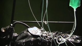 Gorgeous bounded sex doll and latex Domme in the basement