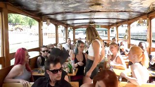 Redhead slut rides a dick on public boat