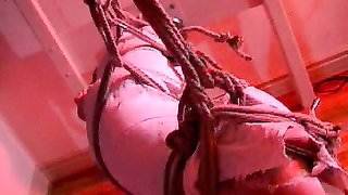 Sex doll with mouth stretcher is waiting for help