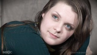 Real Time Bondage babe with green eyes looks nice in black stockings