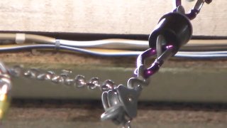 Speechless hottie in latex t-shirt is trying to escape