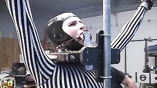 Hot lady in striped latex dress gets chained and caned