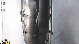 Slender redhead looks extremely sexy in leather suit