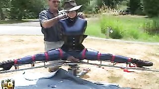 Master built a spiky dildo for his flexible slave to sit on