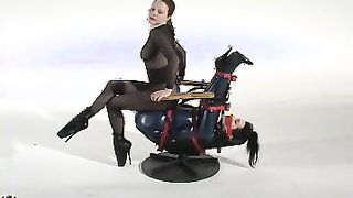 Round ass whore in latex is turned into a living chair