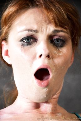 Awesome redhead with blue eyes submissively sucks a dick