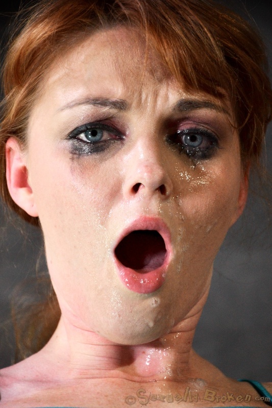 Awesome redhead with blue eyes submissively sucks a dick