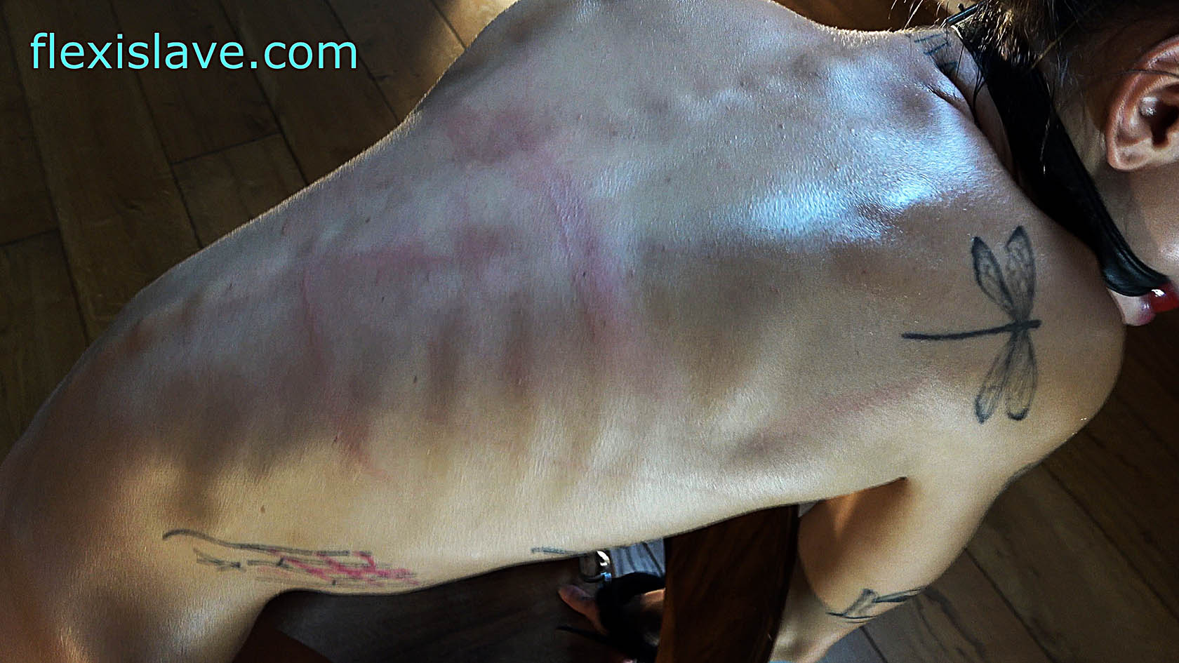 Super Skinny Fitness Pornstar Adelle Unicorn tied to a chair and harshly whipped from backside