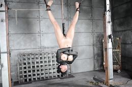 Asian slut in leather straitjacket forced to suck