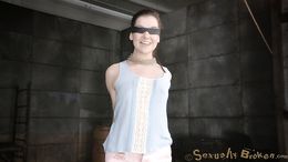 Blindfolded teen in blue dress sucks a dick with tied hands