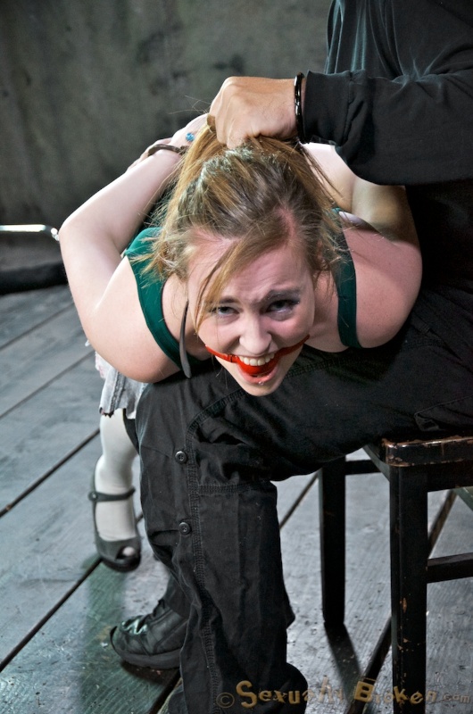 Gagged teen used as a dick-swallowing doll