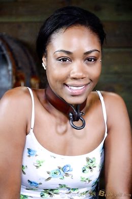 Caged ebony slave sucks a big black sausage